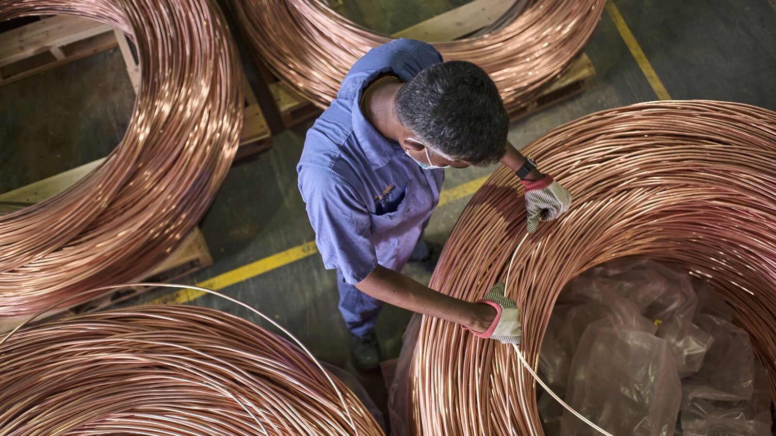Men Checking Ducab cable in the corporate facility